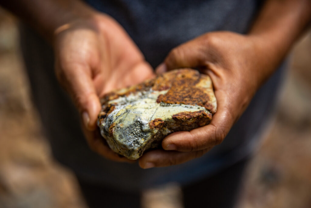 A stone that contains copper found in the Tosoy stream, close to the mining project area. Locals say no fish live in this stream because of the high levels of water mineralization. Humans do not consume the water, either. To them, this shows how mining could lead to the contamination of water, affecting human settlements and biodiversity / credit: Antonio Cascio